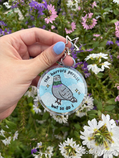 The Horrors Persist, But So Do I Keychain